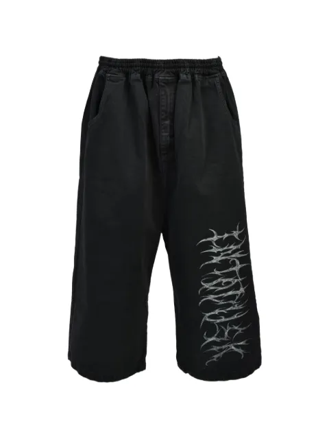 Intodusk Dustshadow logo-print jeans Black ESPI547