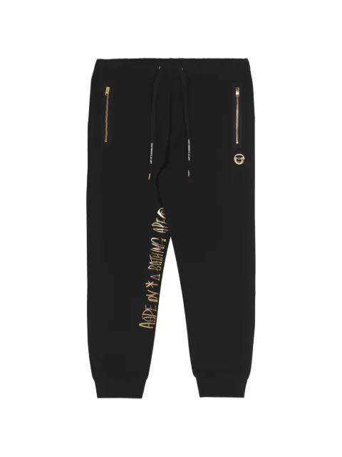 AAPE BY *A BATHING APE® Moonface printed track pants Black AAPPTM6937XXJ
