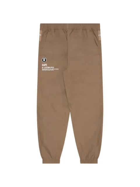AAPE BY *A BATHING APE® Moonface reversible tie-dye track pants Green AAPPTM6920XXJ