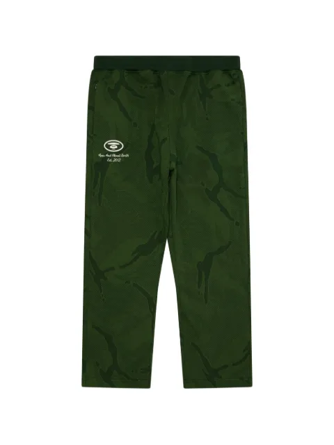 AAPE BY *A BATHING APE® Moonface camo-pattern track pants Green AAPPTMC653XXP