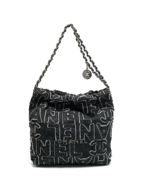 CHANEL Pre-Owned Chanel 22 logo-patchwork shoulder bag Black 1385937