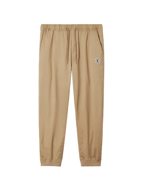 FINGERCROXX logo-patch tapered track pants Neutrals FFXPTM01446X