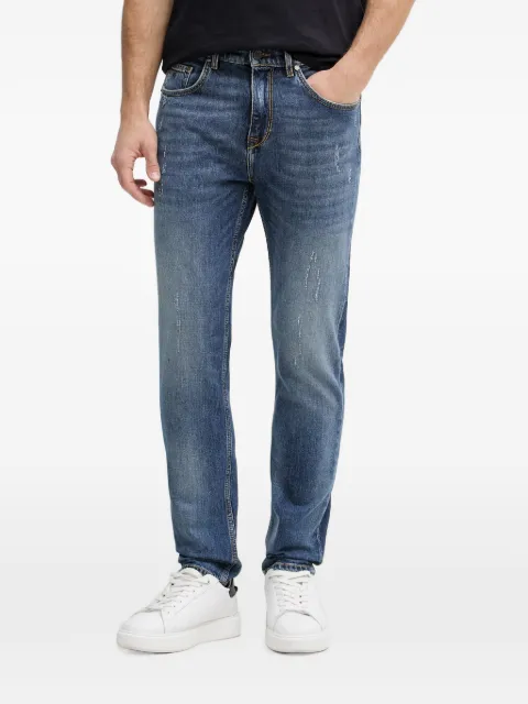 Karl Lagerfeld distressed logo-patch jeans Blue 265508562850
