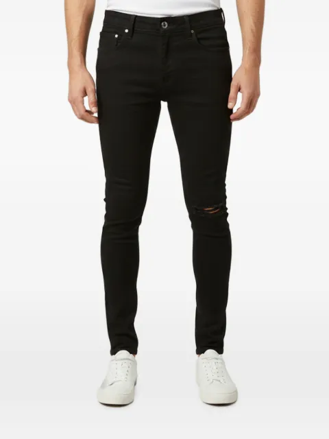 AMIRI distressed skinny jeans Black 1347059