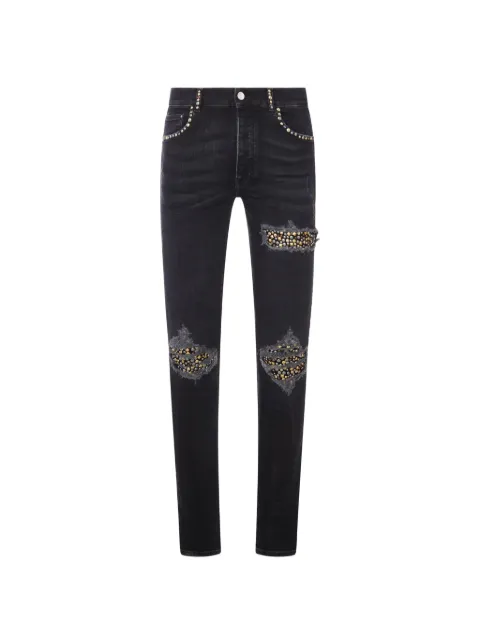 AMIRI stud-embellished distressed jeans Black AMBMJE1123