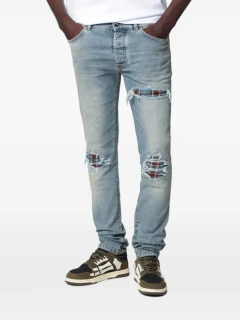 AMIRI distressed-effect patched jeans Grey AMBMJE1152