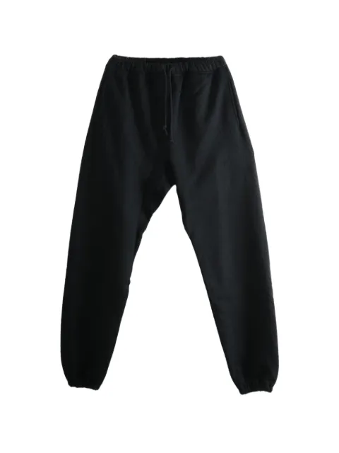 MONONOKE MADE sunflower-print track pants Black MTMK80000016