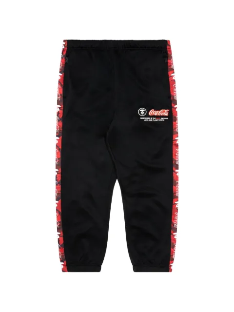 AAPE BY *A BATHING APE® x Coca-Cola Moonface-patch camouflage-tape track pants Black AAPPTM9644XXJ
