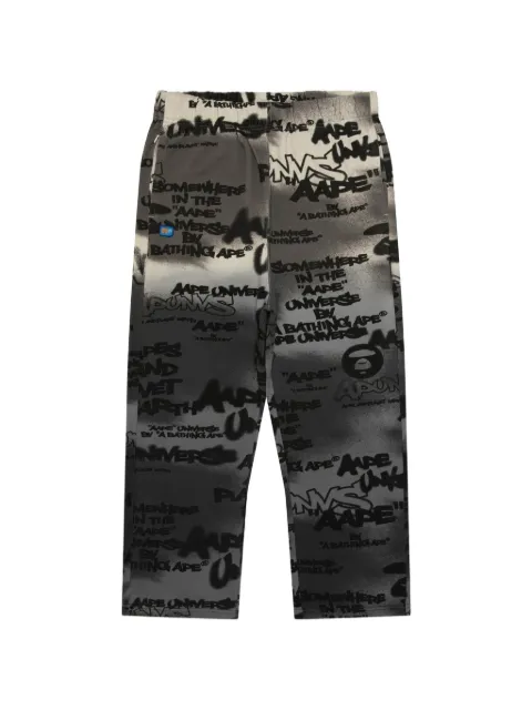 AAPE BY *A BATHING APE® Aapeunvs graffiti-print track pants Grey AAPPTMD615XXQ