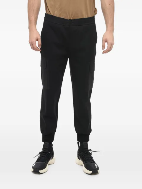 Neil Barrett low-rise skinny-fit tapered trousers Black PBJP049CHU508C01