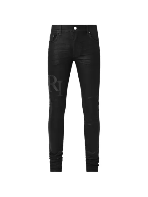 AMIRI logo-patch waxed jeans Black AM5JE005