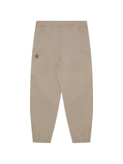 AAPE BY *A BATHING APE® Moonface-patch track pants Neutrals AAPPTMA662XXM