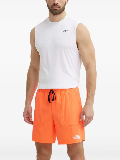 The North Face logo-print track shorts Orange NF0A88S9QI41