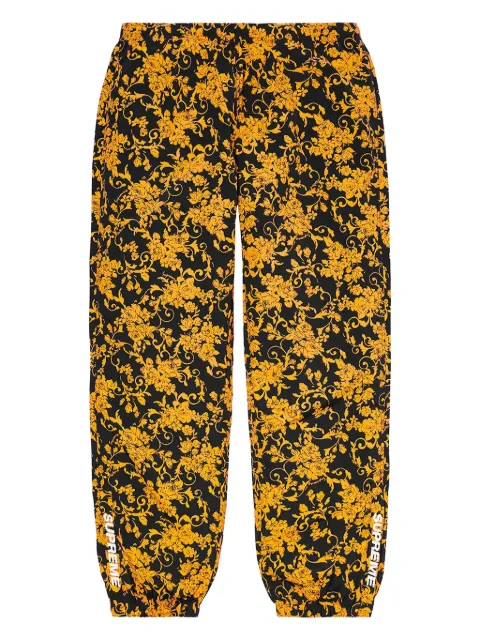 Supreme floral-pattern track pants Black SUPWARMUPPANTBLKFL01