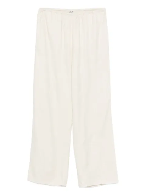 TOTEME monogram-pattern trousers Neutrals 241WRB1101FB0080116