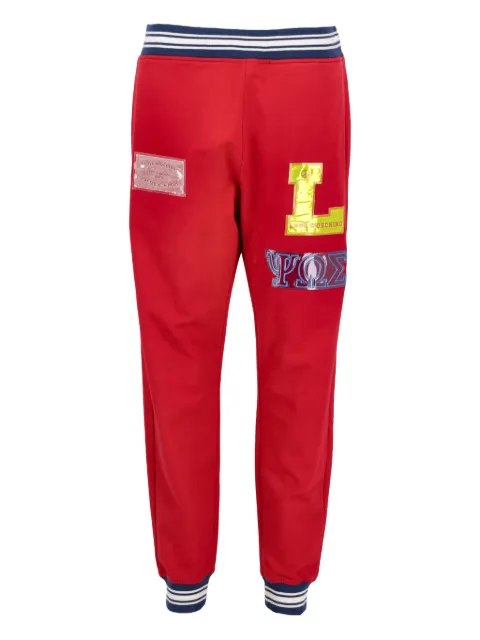 Moschino Pre-Owned logo-patch track pants Red WCV25081702