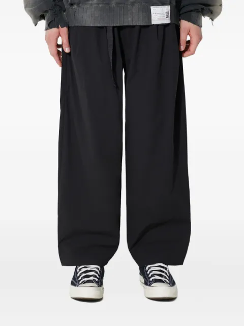 MANASTASH zip-pocket trousers Black 7924110005