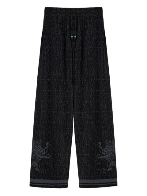 Domaine Des Artistes lion-embellished patterned silk trousers Black DDAP02BK00