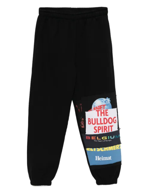 VETEMENTS graphic-print trousers Black MAH57PB439