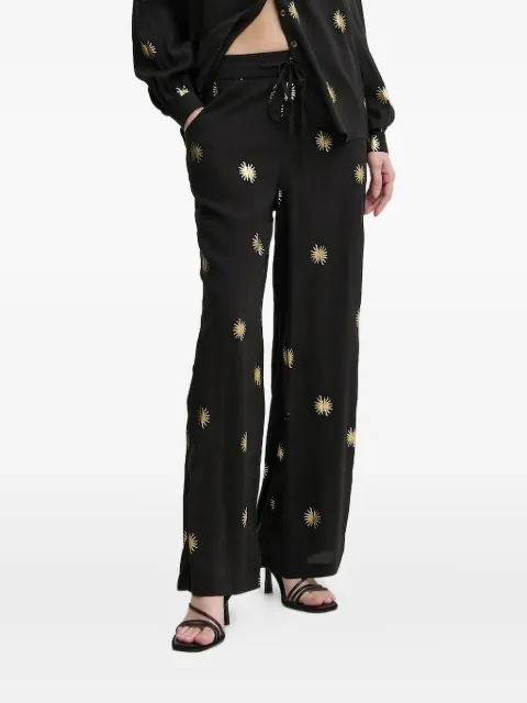 NEVER FULLY DRESSED sun-print trousers Black NFDTR405