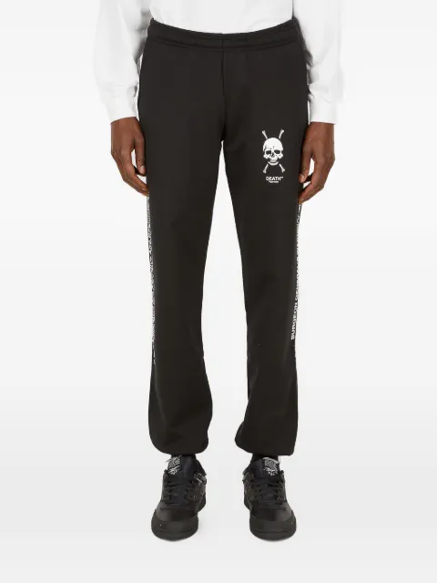 Death Cigarettes skull logo print trousers Black DC010