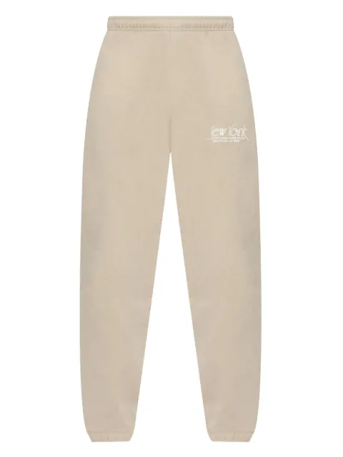 Sporty & Rich slogan-print track pants Neutrals PA036622508