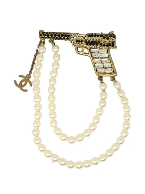 CHANEL Pre-Owned 2001 gun-motif brooch Gold B01A