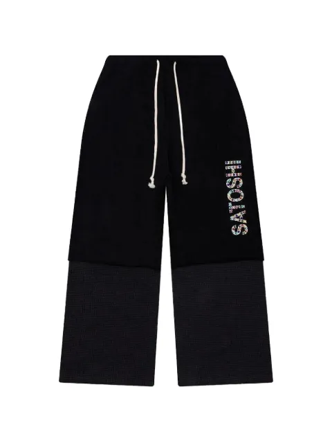 SATOSHI NAKAMOTO double-layer studded track pants Black FW24SWP001
