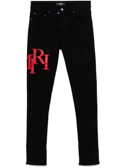 AMIRI staggered logo skinny jeans Black AMDNSY1114