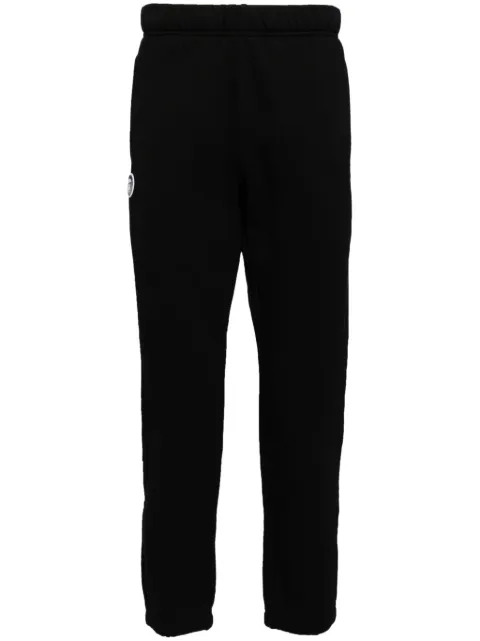 AAPE BY *A BATHING APE® Moonface logo track pants Black APTB638XXN