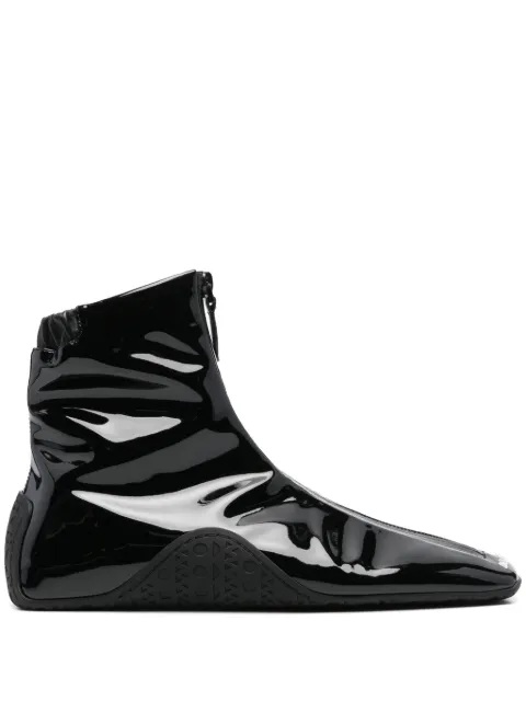 Alaïa logo-embossed sneakers Black AA3T019TK024