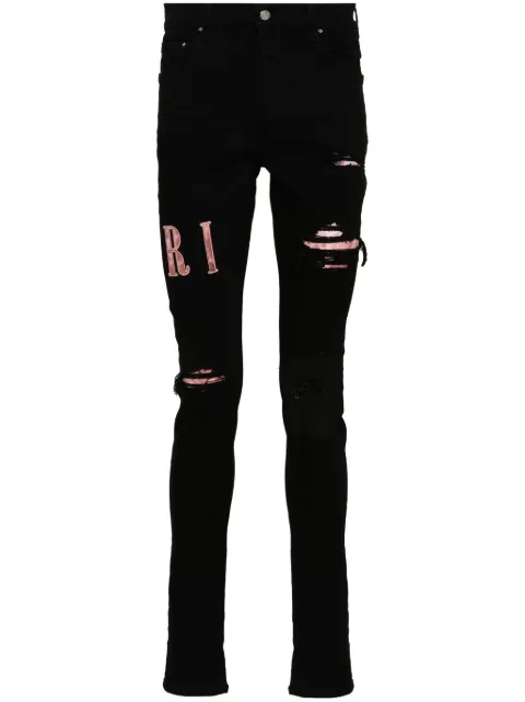 AMIRI waxed logo-appliqué skinny jeans Black AMDNSY1016