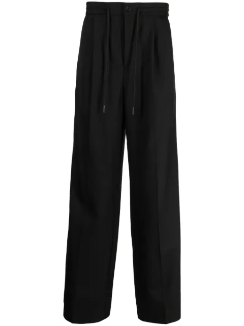 Holzweiler pressed-crease tailored trousers Black 17174