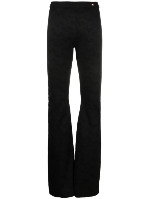 Versace Greca-knit flared trousers Black 10019141A05236