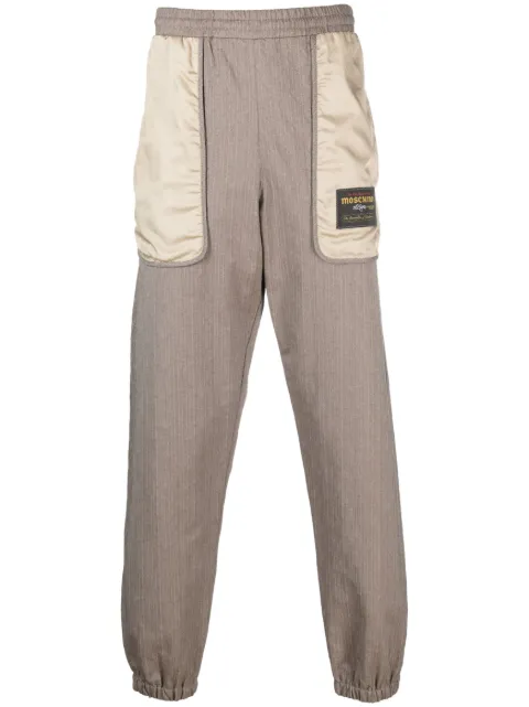Moschino logo-patch panelled track pants Brown A03045216