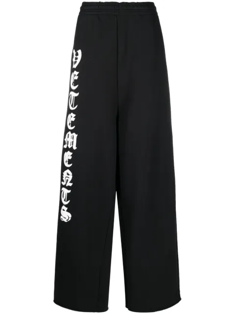 VETEMENTS logo-print wide-leg track pants Black UE63SP271B