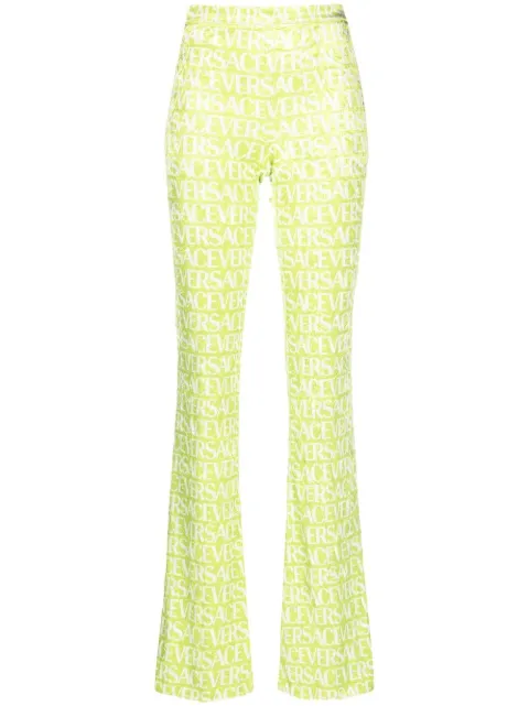 Versace logo-print flared trousers Green 10086911A06579