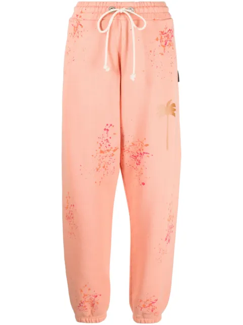 Palm Angels PXP paint-splatter track pants Orange PWCH006S23FLE0013322