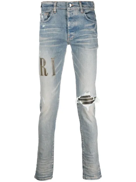 AMIRI logo-print distressed skinny jeans Blue MDS010
