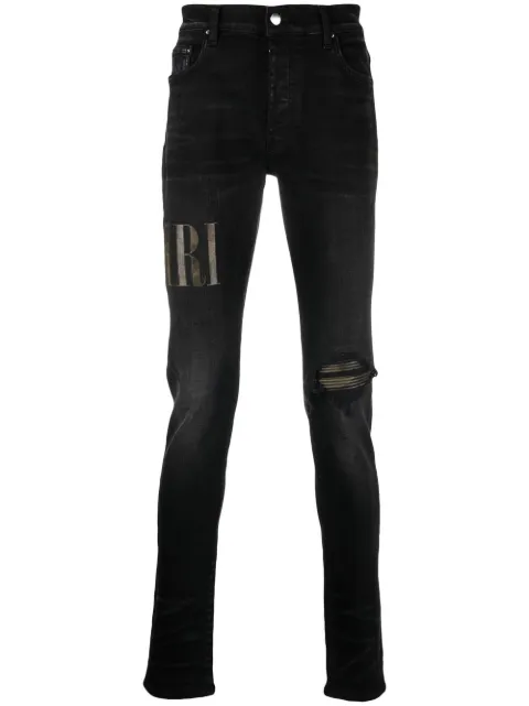 AMIRI logo-appliqué distressed jeans Black PF22MDS010