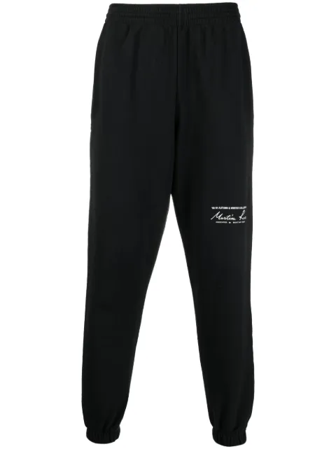 Martine Rose logo-print slim-fit track pants Black CMR607FL