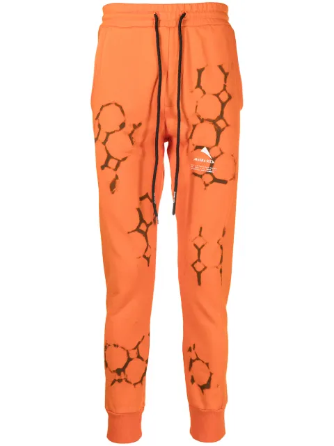 Mauna Kea logo-print detail track pants Orange MKS227A33