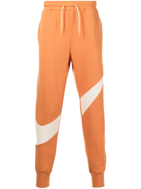 Nike swoosh-print fleece track pants Orange DH1023