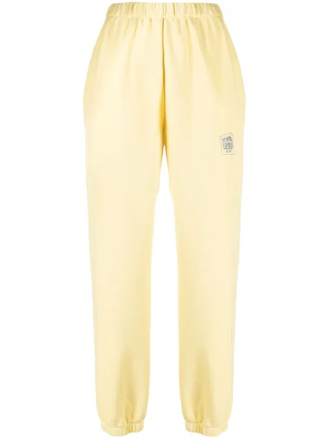 Opening Ceremony warped logo-print track pants Yellow YWCH003S21FLE0021701